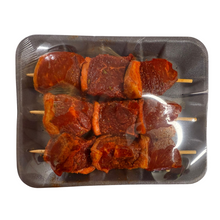 Load image into Gallery viewer, Skewers of marinated meat on a metal tray with a white background
